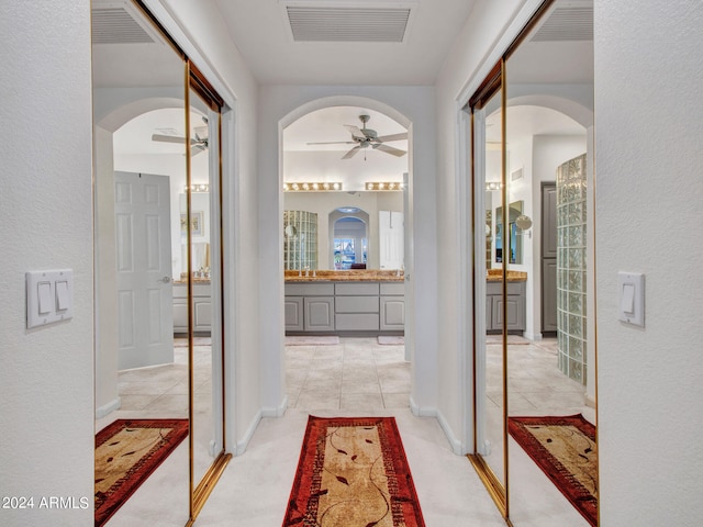 hallway with light tile patterned floors