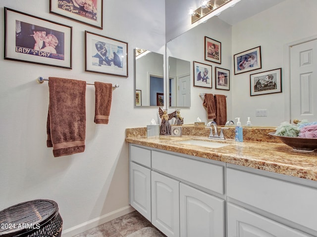 bathroom with vanity and tile patterned floors