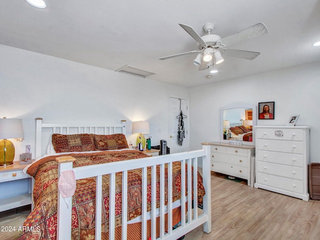 bedroom featuring ceiling fan and light hardwood / wood-style flooring