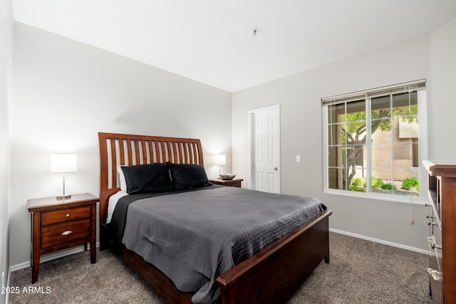 bedroom featuring carpet floors and baseboards