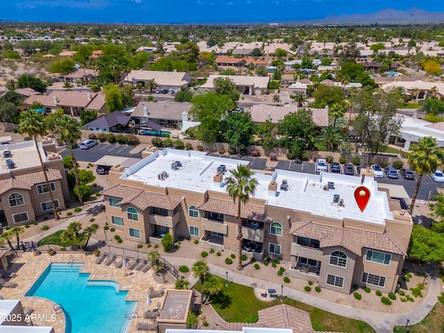 aerial perspective of suburban area featuring a pool area