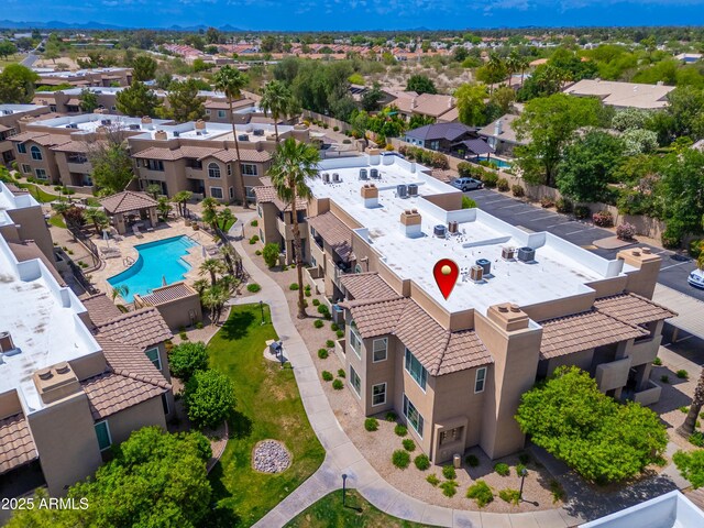 aerial view of residential area featuring a pool