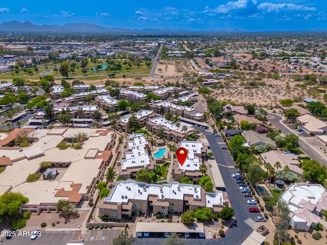 aerial view of residential area with mountains
