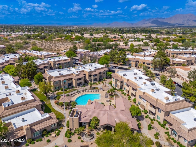 bird's eye view of a pool area and a mountain backdrop
