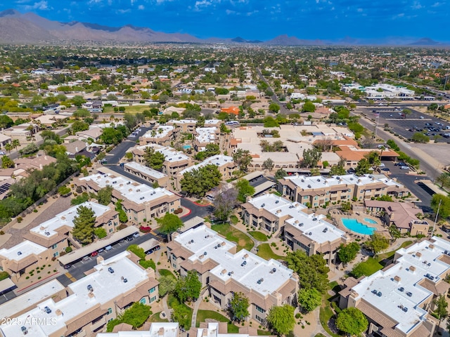 drone / aerial view of a pool and mountains