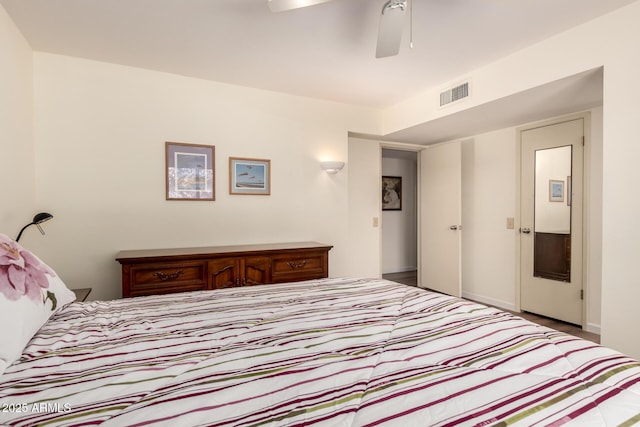 bedroom featuring visible vents, a ceiling fan, and baseboards