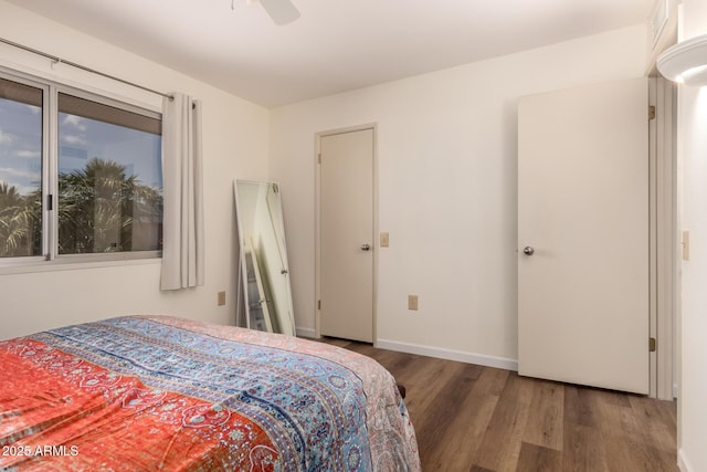 bedroom with wood finished floors, ceiling fan, and baseboards