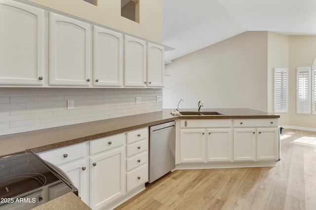 9216 E Rocky Lake Dr, Sun Lakes, AZ 85248 - kitchen with dark countertops, stainless steel dishwasher, a peninsula, and a sink