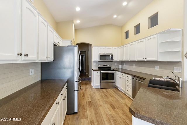 9216 E Rocky Lake Dr, Sun Lakes, AZ 85248 - kitchen featuring white cabinetry, open shelves, decorative backsplash, a sink, and appliances with stainless steel finishes