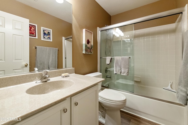 9216 E Rocky Lake Dr, Sun Lakes, AZ 85248 - bathroom featuring wood finished floors, a textured wall, toilet, and vanity