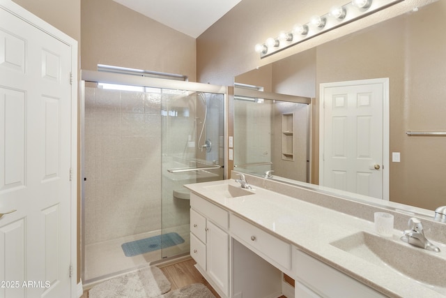 9216 E Rocky Lake Dr, Sun Lakes, AZ 85248 - bathroom featuring a stall shower, double vanity, and a sink