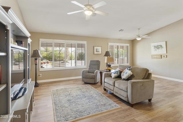 9216 E Rocky Lake Dr, Sun Lakes, AZ 85248 - living room featuring baseboards, visible vents, wood finished floors, and ceiling fan