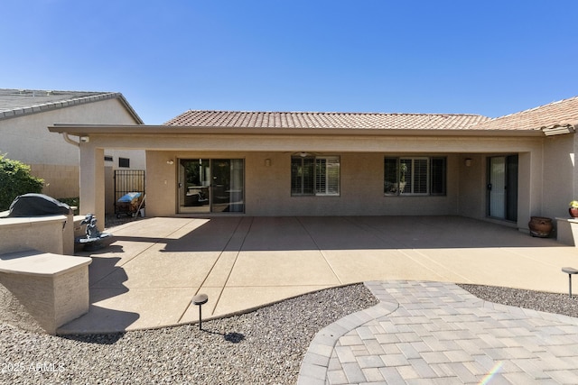 9216 E Rocky Lake Dr, Sun Lakes, AZ 85248 - rear view of property with fence, stucco siding, a tile roof, and a patio area