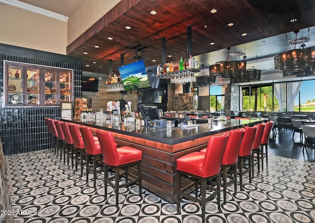 9216 E Rocky Lake Dr, Sun Lakes, AZ 85248 - bar featuring ornamental molding, recessed lighting, and a dry bar