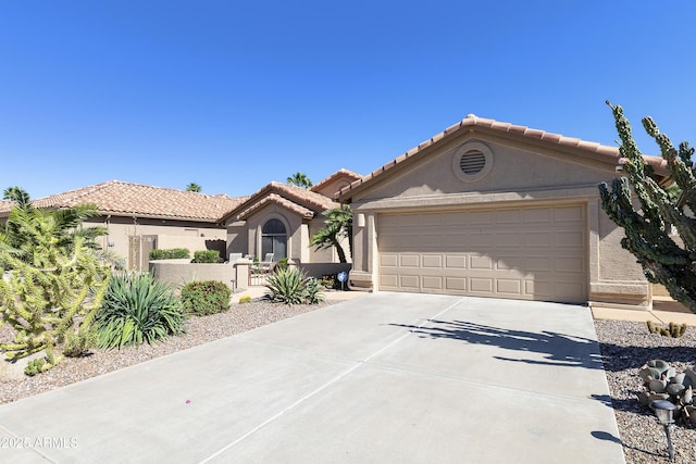9216 E Rocky Lake Dr, Sun Lakes, AZ 85248 - view of front of property with a tile roof, concrete driveway, stucco siding, and an attached garage