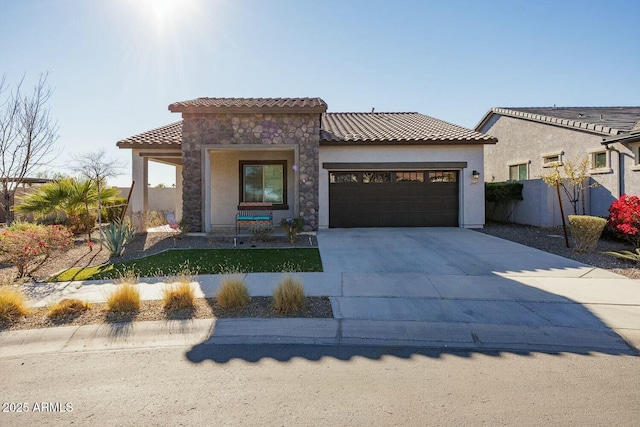 mediterranean / spanish-style home featuring a garage