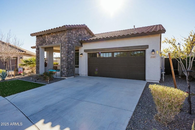 mediterranean / spanish-style house with a garage