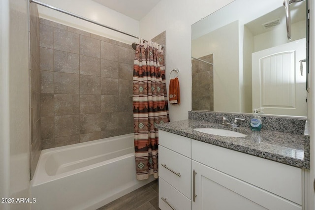 bathroom featuring vanity and shower / tub combo with curtain