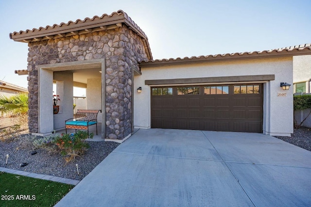 mediterranean / spanish house featuring a garage