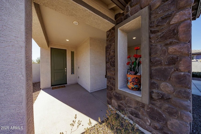 property entrance with a patio