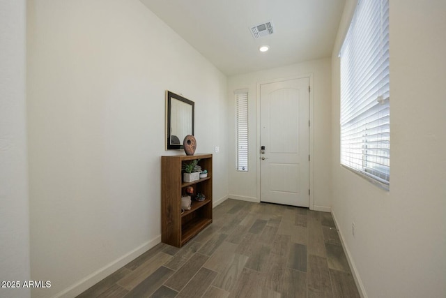 entryway with dark wood-type flooring