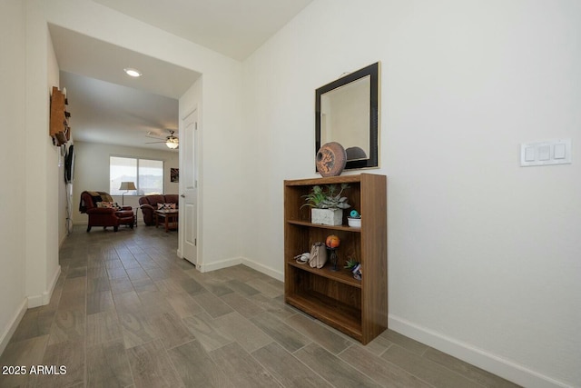 hallway with hardwood / wood-style flooring