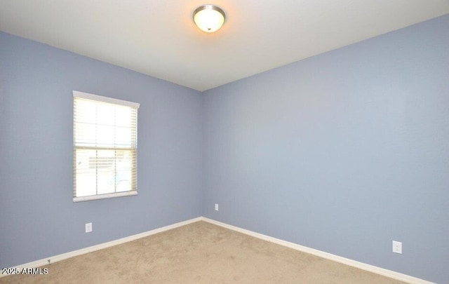 unfurnished room featuring carpet floors