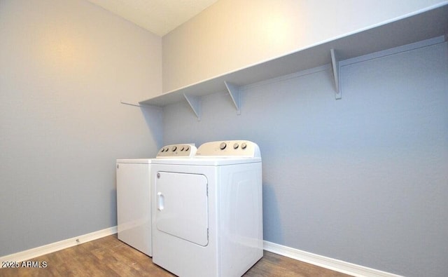 laundry area featuring dark hardwood / wood-style flooring and independent washer and dryer