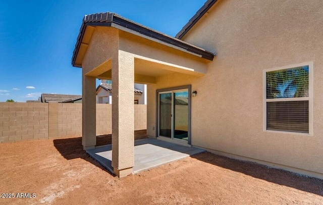 rear view of property featuring a patio