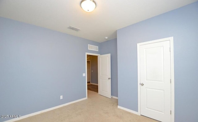 unfurnished bedroom with light carpet