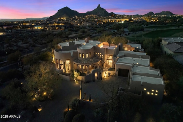 aerial view at dusk with a mountain view