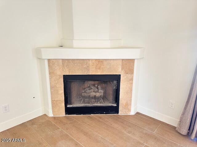 room details featuring a tile fireplace