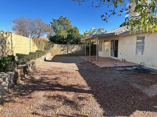 view of yard with a patio and central AC