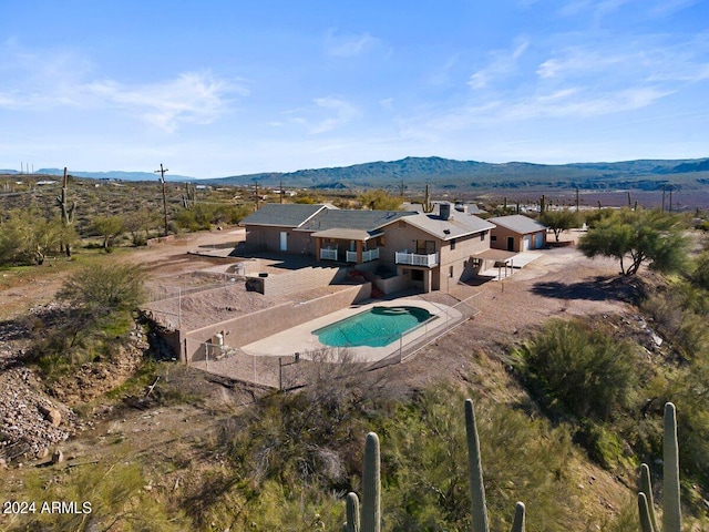 exterior space featuring a mountain view and a patio