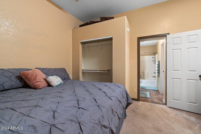 bedroom with a closet, carpet, and vaulted ceiling