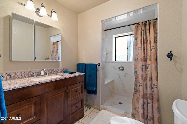 bathroom featuring tile patterned floors, toilet, vanity, and a shower with shower curtain