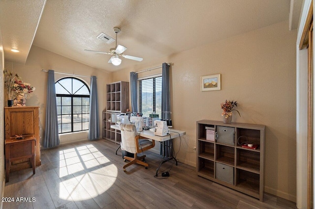 office area with hardwood / wood-style flooring, vaulted ceiling, and plenty of natural light