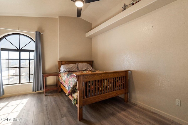 bedroom with ceiling fan, dark hardwood / wood-style flooring, and lofted ceiling