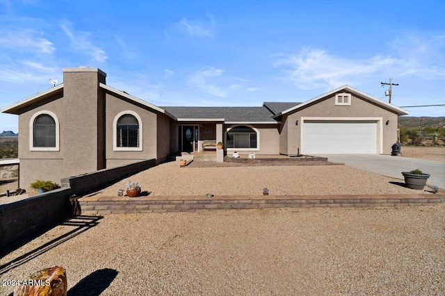 ranch-style home with a garage