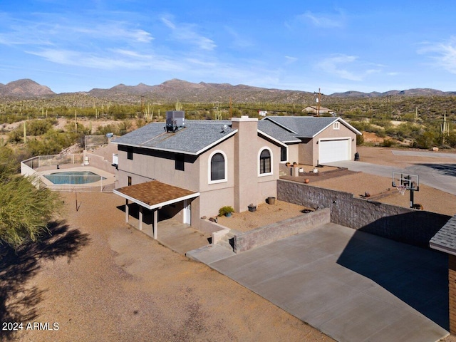 birds eye view of property with a mountain view