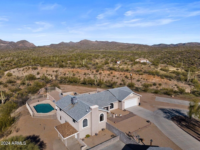 birds eye view of property with a mountain view