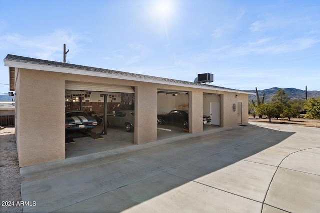 exterior space featuring a mountain view and cooling unit