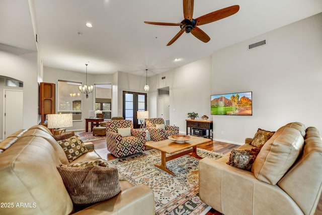 7304 E Bent Tree Dr, Scottsdale, AZ 85266 - living room with ceiling fan, a chandelier, wood finished floors, recessed lighting, and baseboards