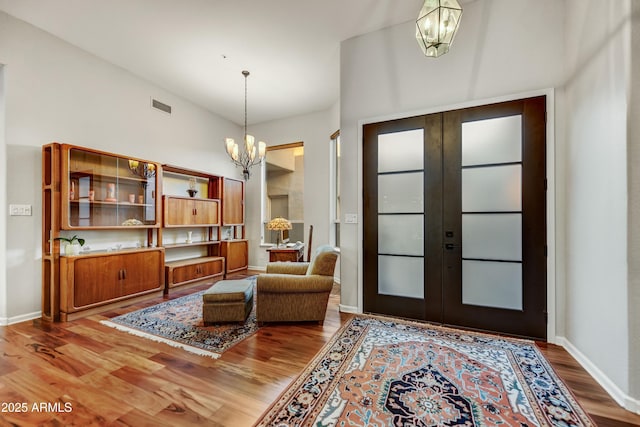 7304 E Bent Tree Dr, Scottsdale, AZ 85266 - entryway featuring a chandelier, wood finished floors, french doors, and baseboards