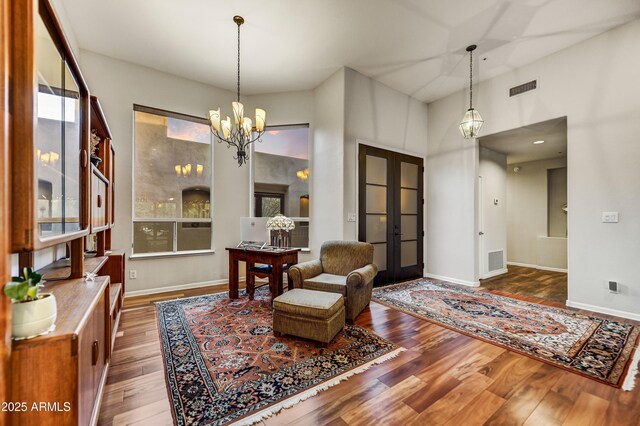7304 E Bent Tree Dr, Scottsdale, AZ 85266 - sitting room featuring a chandelier, wood finished floors, and baseboards