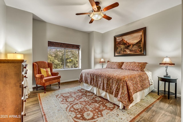 7304 E Bent Tree Dr, Scottsdale, AZ 85266 - bedroom featuring wood finished floors, baseboards, and a ceiling fan