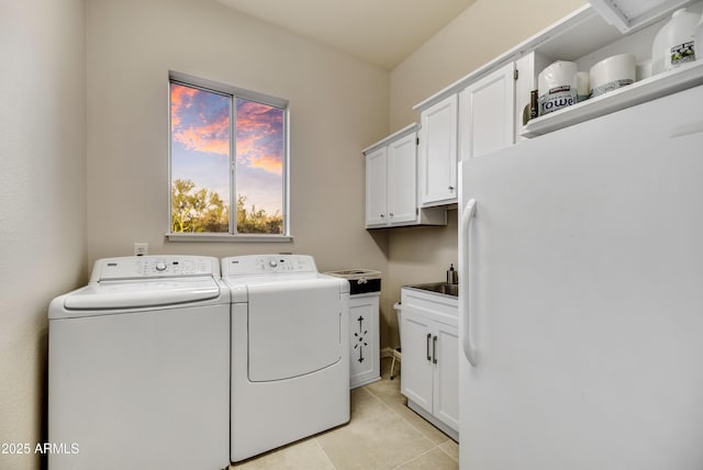 7304 E Bent Tree Dr, Scottsdale, AZ 85266 - laundry area featuring washer and clothes dryer, cabinet space, and light tile patterned flooring