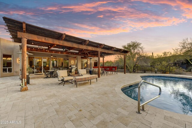 7304 E Bent Tree Dr, Scottsdale, AZ 85266 - pool at dusk featuring a pergola, a ceiling fan, and a patio area