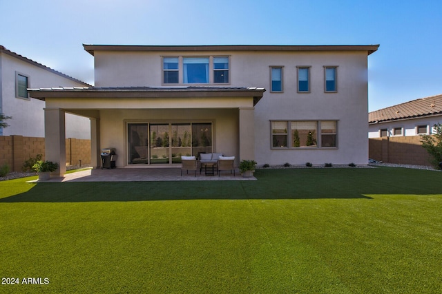 back of property with a patio area, outdoor lounge area, and a yard