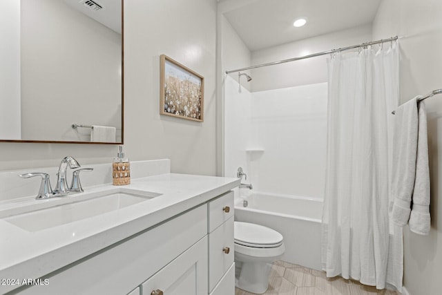 full bathroom with toilet, vanity, and shower / bath combo with shower curtain